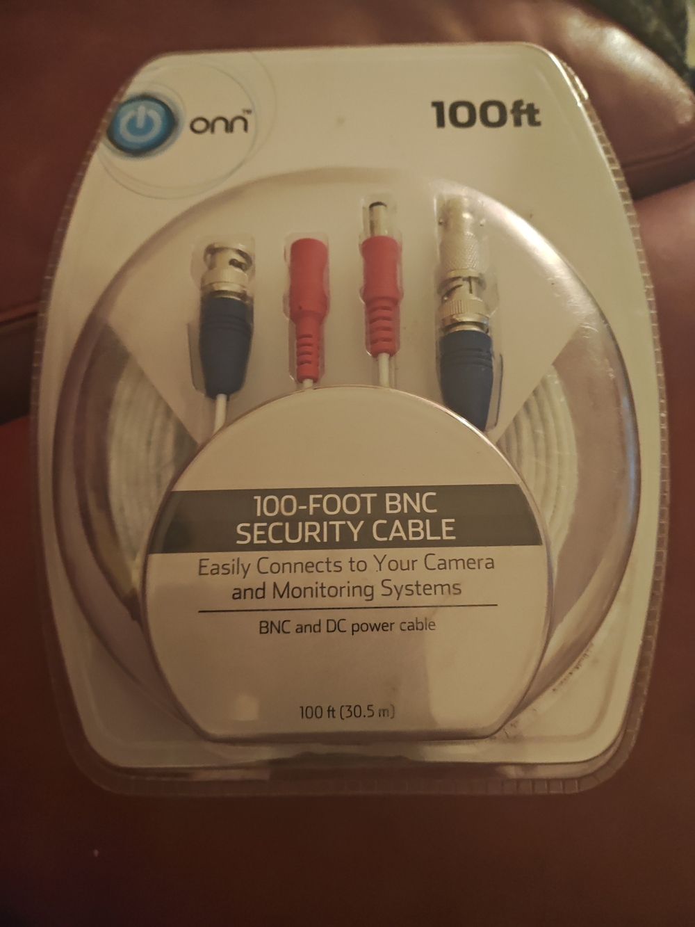On Running White Security Cable with Red and Blue Connector Accents